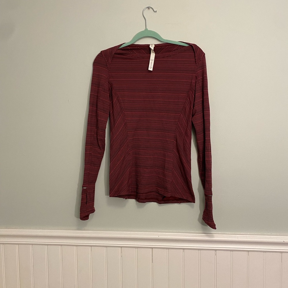 Lululemon size 8 long sleeve workout top. Red and black stripe